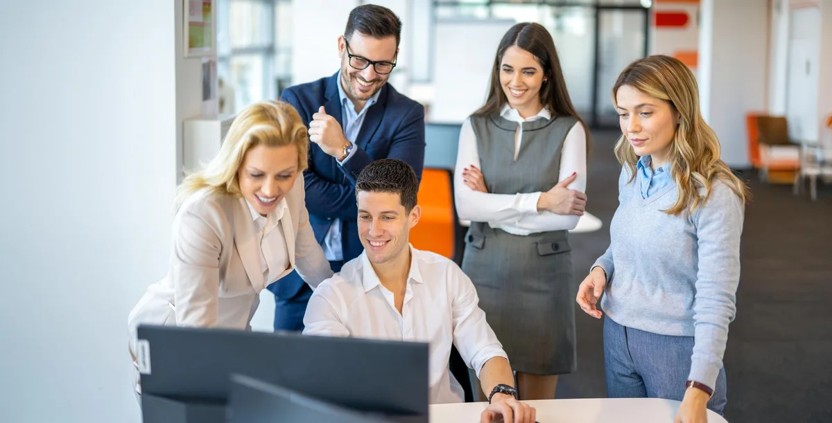 Business people celebrating successful SEO presentation meeting - Close deals with refurbished IT hardware SEO strategies